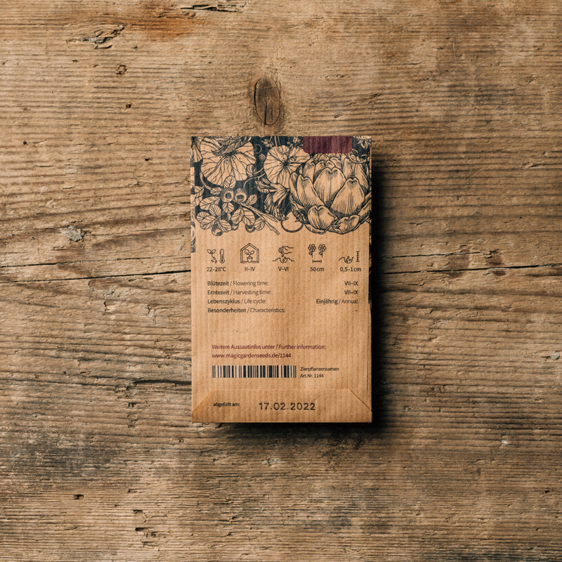 Dos d'un sachet de graines avec symboles de semis, périodes de floraison et de récolte et date de conditionnement
